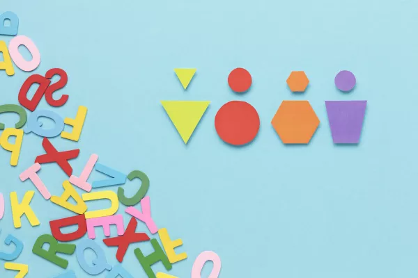 different-colored-geometrical-shapes-blue-background.jpg